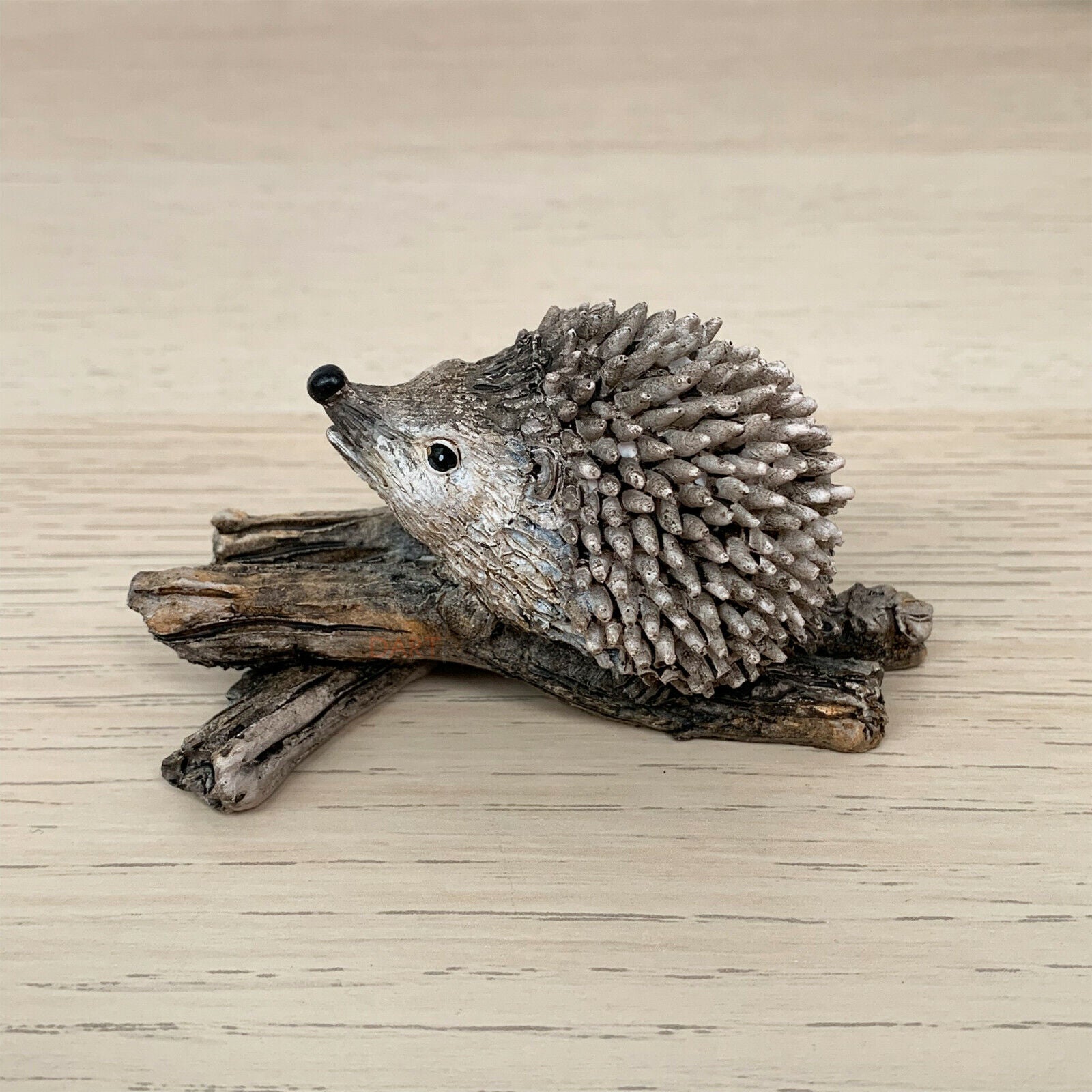 Miniature Pair Of Hedgehogs On Branch