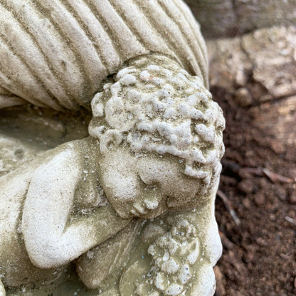 Stone Cherub In Shell Garden Sculpture