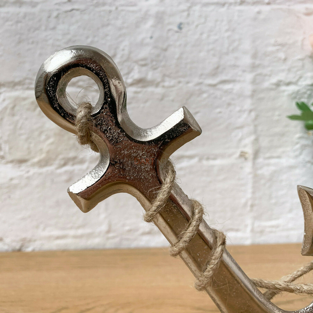 Silver Metal Anchor Ornament On Wooden Stand