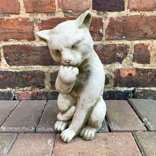 Stone Paw Licking Cat Garden Sculpture