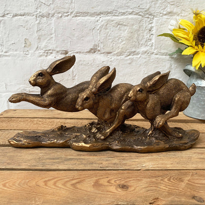 Bronze Three Jumping Hares Ornament