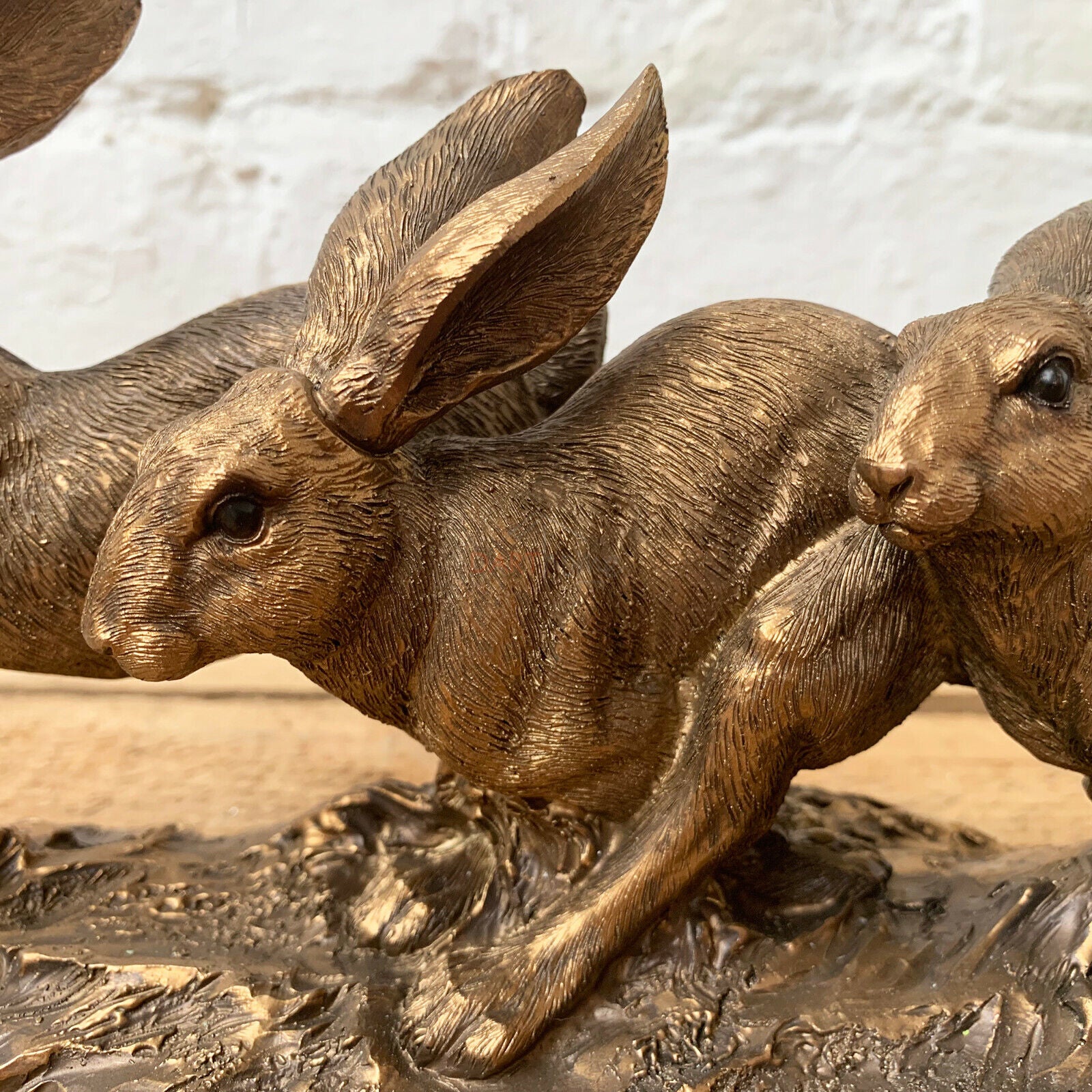Bronze Three Jumping Hares Ornament