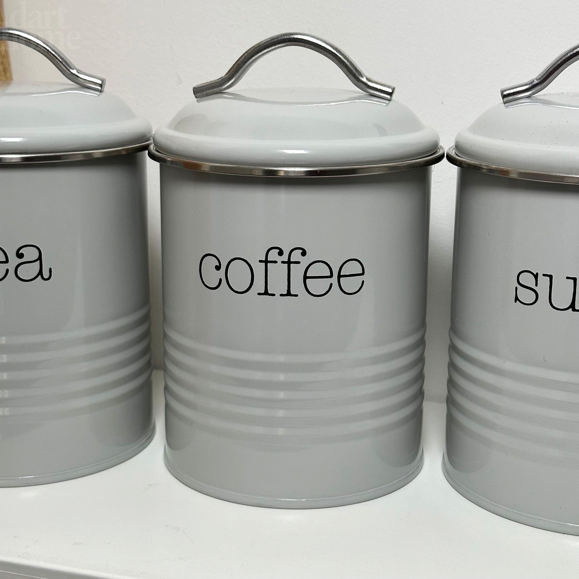 Graue Tee-, Kaffee- und Zuckerdosen