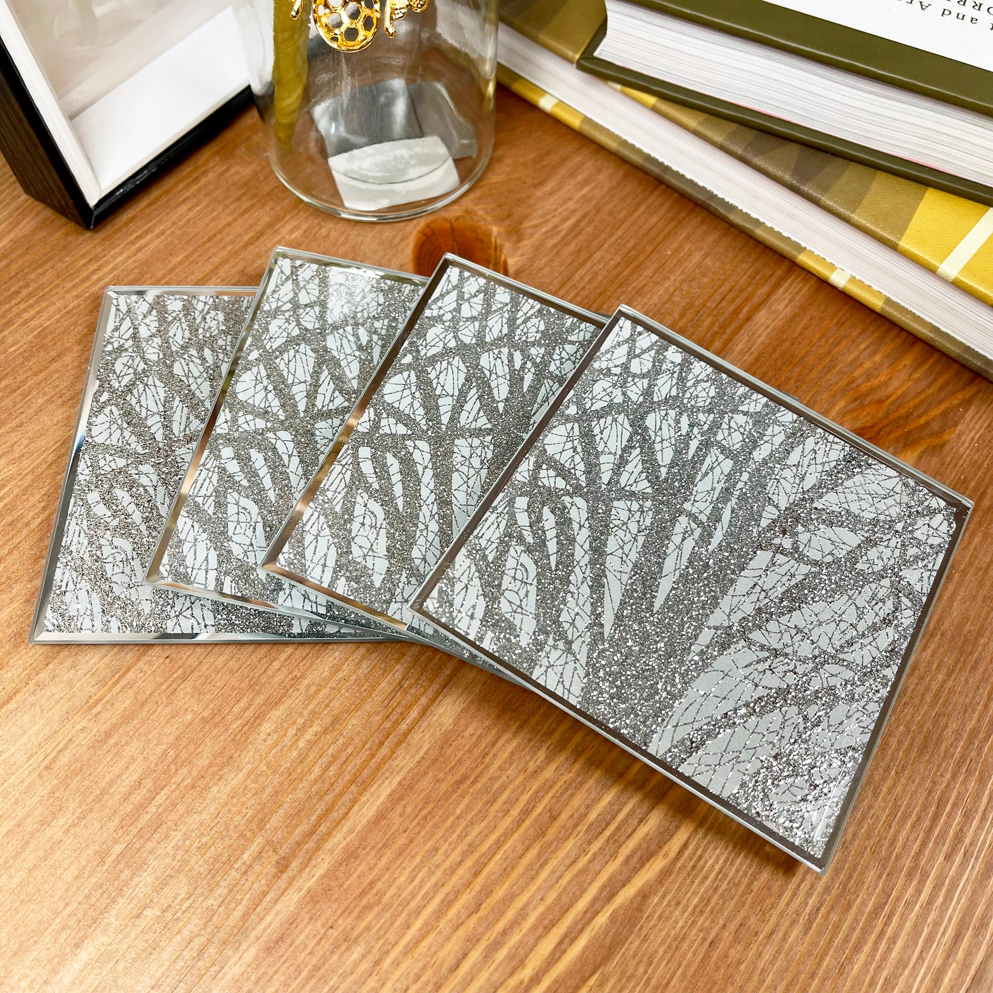 Set mit 4 silbernen glitzernden Woodland-Glasuntersetzern