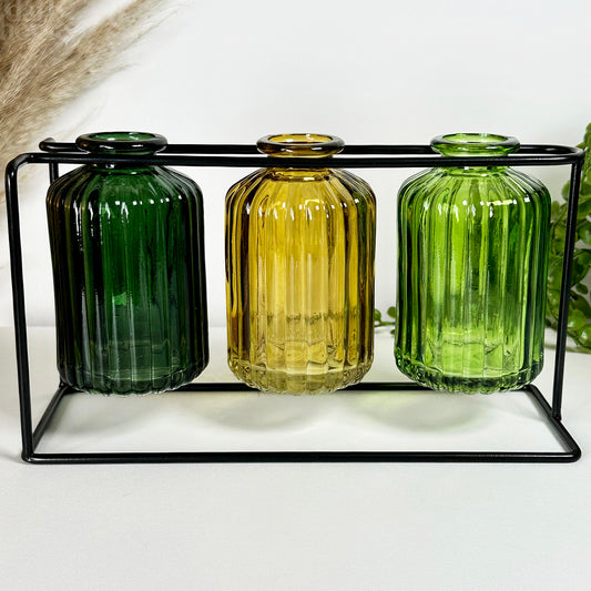 Three Hanging Bottle Vases With Metal Stand