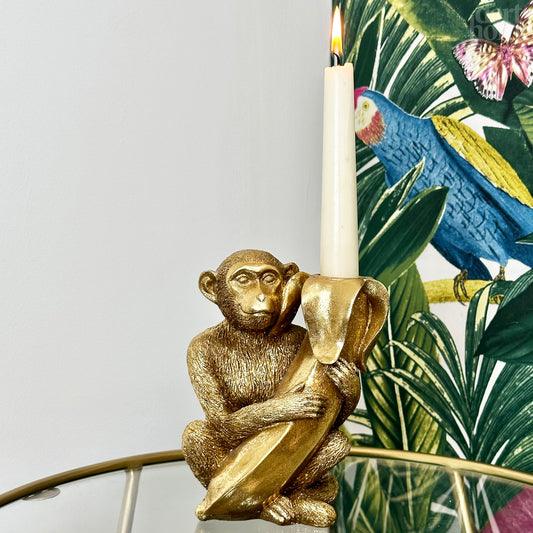 Goldener Affe mit Bananen-Kerzenhalter