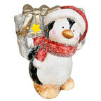 Leuchtende Pinguinfigur mit Geschenk