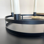 Schwarzer runder Kerzenhalter