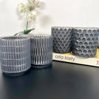 Set mit 4 geometrischen Teelichthaltern