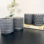 Set mit 4 geometrischen Teelichthaltern