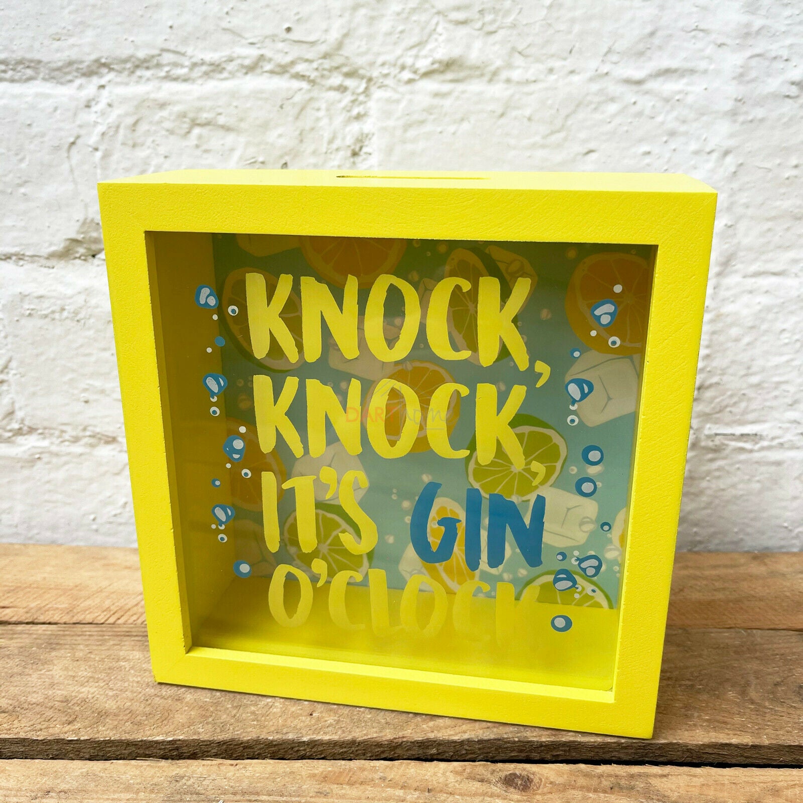 Gelbe Gin-Spardose